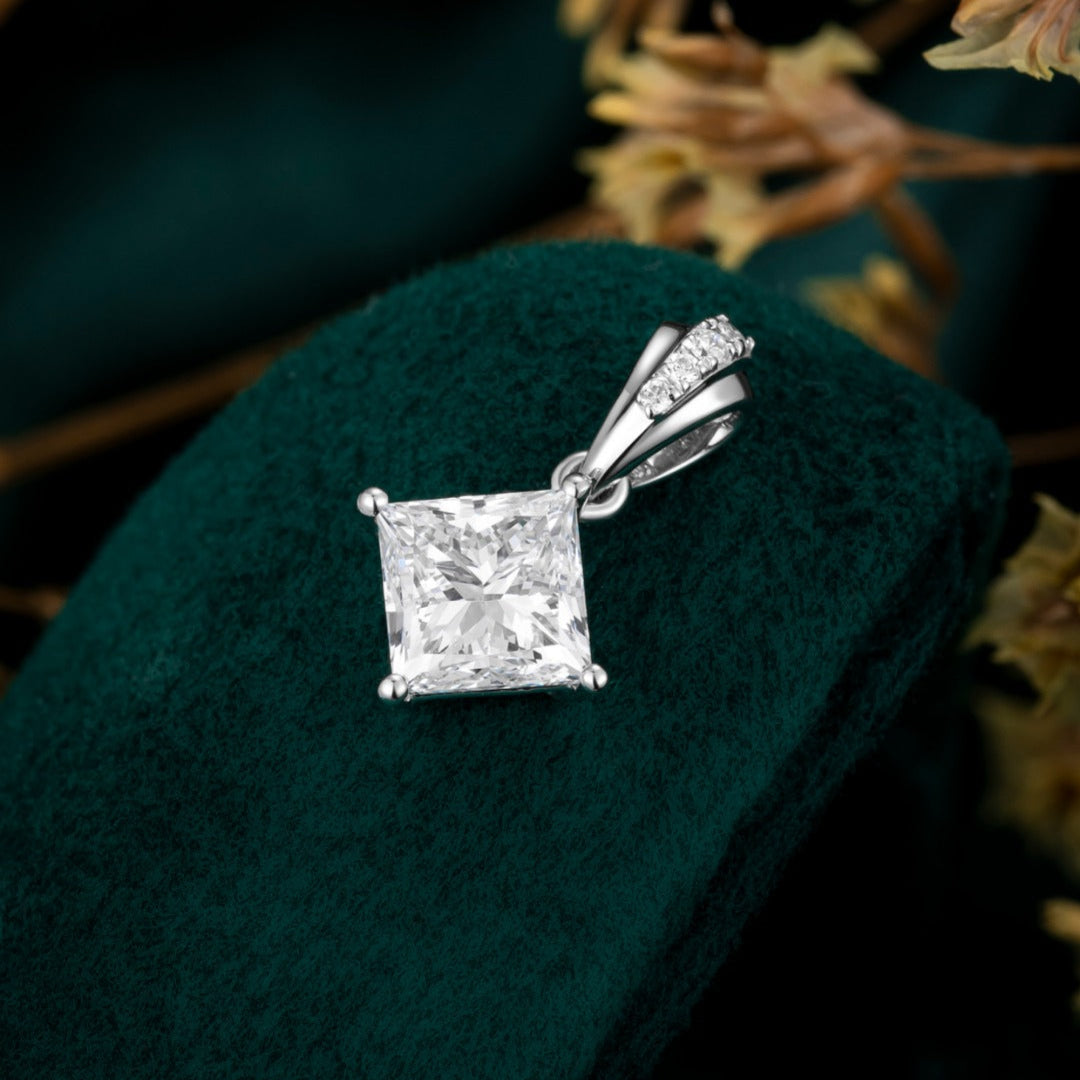 Timeless elegance meets modern simplicity with this solitaire pendant showcasing a lab-grown princess-cut diamond. Set in your choice of 14K White, Yellow, or Rose Gold, this design makes a refined statement whether layered or worn alone.