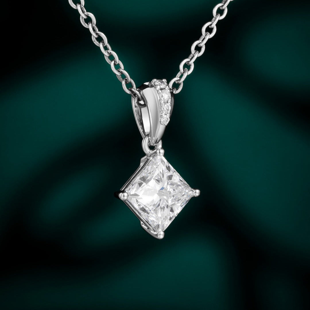 Timeless elegance meets modern simplicity with this solitaire pendant showcasing a lab-grown princess-cut diamond. Set in your choice of 14K White, Yellow, or Rose Gold, this design makes a refined statement whether layered or worn alone.