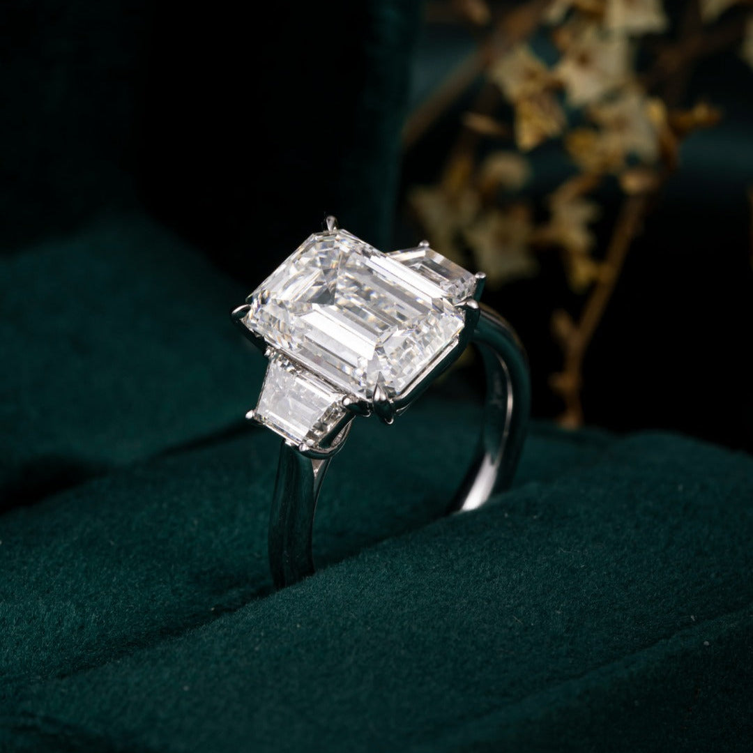 5ct Three Stone Emerald Trapezoid Sidestone Engagement Ring in Platinum