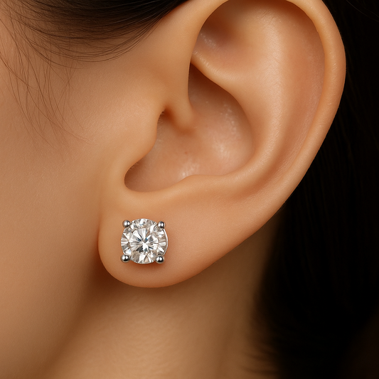 featuring a 0.5 ct around cut lab grown diamond earstuds on a female model's ear, with only 4 prongs setting, made with 14k white gold 